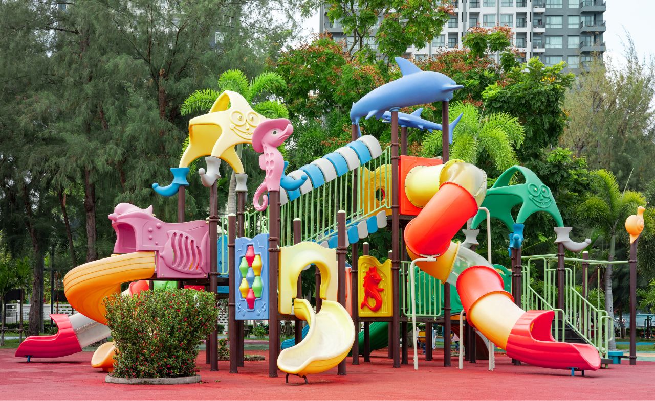 A colorful children’s playground in the middle of a community area.